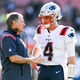 Bill Belichick (left) and Bailey Zappe